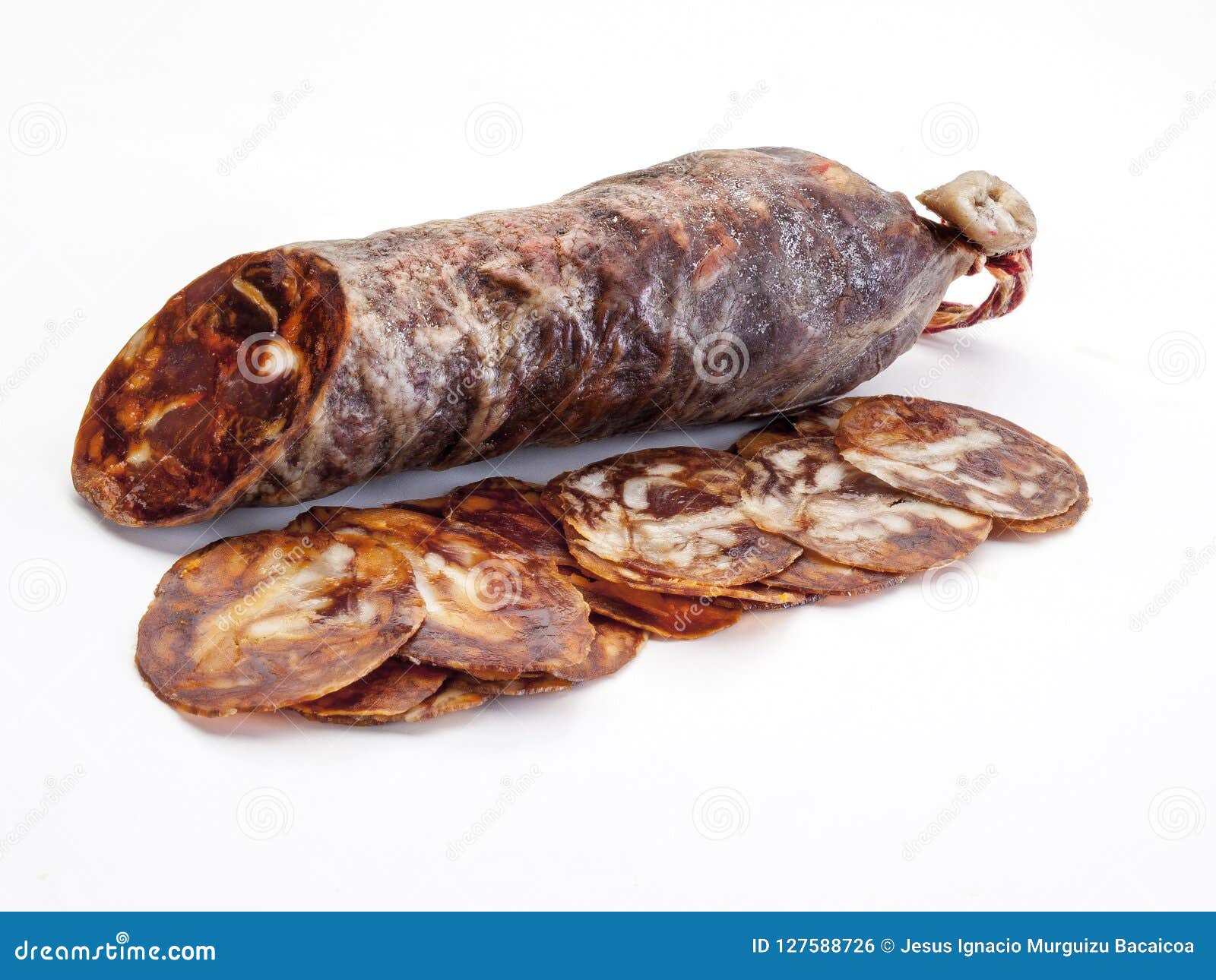 close-up detail of a salamanca chorizo Ã¢â¬â¹Ã¢â¬â¹with several slices of it